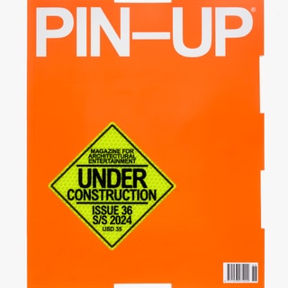 Oranges Magazin-Cover mit Text 'UNDER CONSTRUCTION'.