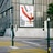 Städtische Strasse mit Plakat der Swiss Design Collection an Gebäude.